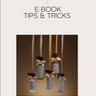 Cover of 'E-Book Tips & Tricks' by Parfumello with perfume bottles on a white background